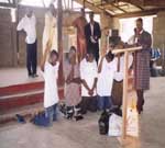 Rev. Bah prays for Sierra Leonean refugees.